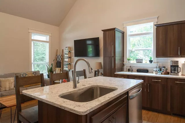 Kitchen Center Island Featuring Moen Faucet