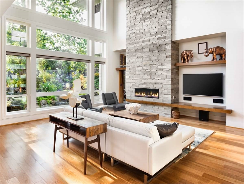 Gorgeous Great Room Featuring Bright Windows and Fireplace
