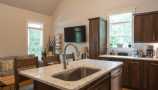 Kitchen Center Island Featuring Moen Faucet