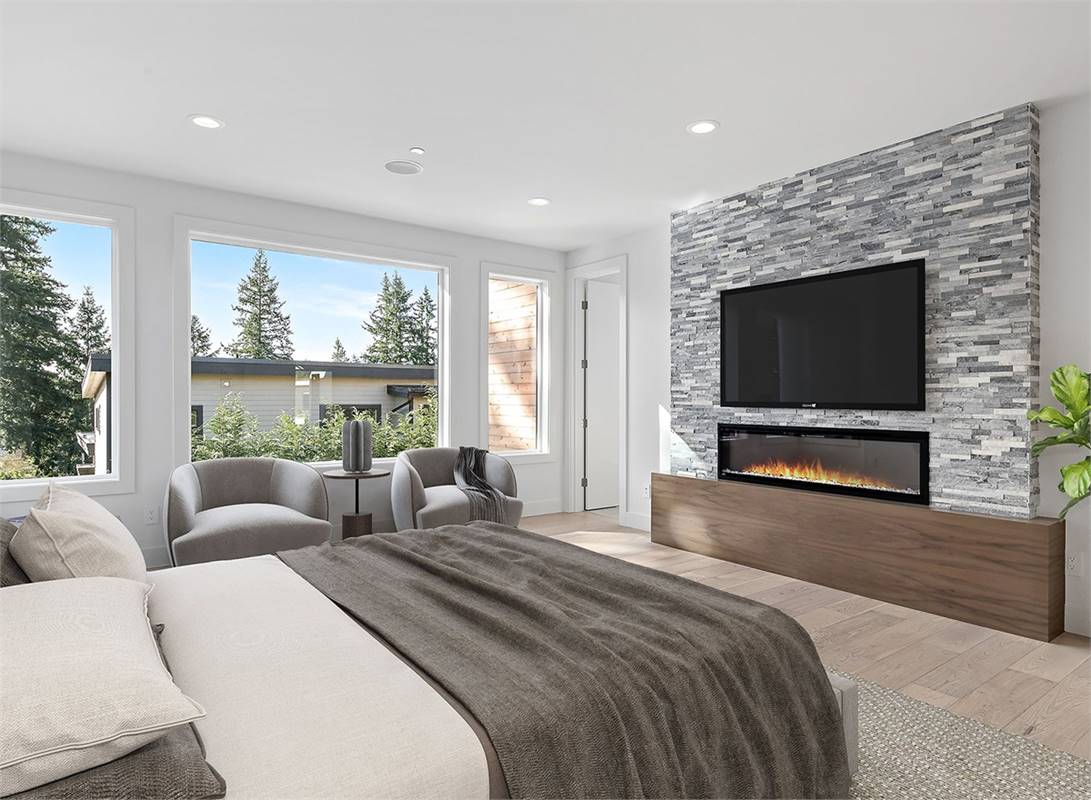 Peaceful Master Bedroom with Gas Fireplace Feature Wall
