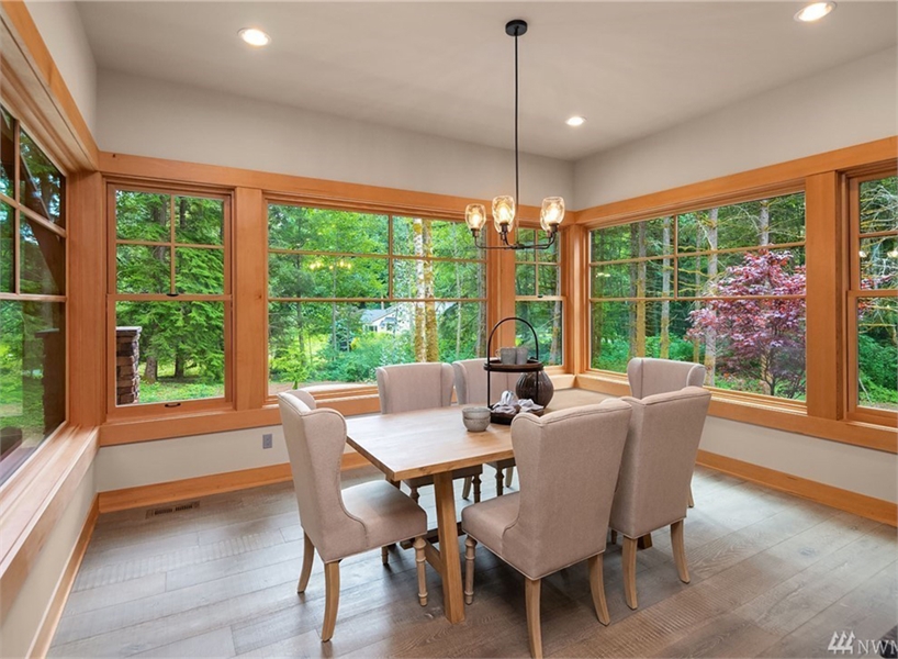 Dining Room with Wrap-Around Windows for Natural Light