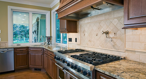 Bright Kitchen with High End Appliances and Backsplash