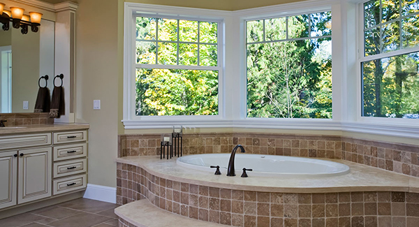 Primary Ensuite Bath with Gorgeous Tub and Lots of Windows