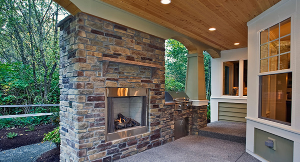 Impressive View of Exterior Fireplace at Outdoor Living Area