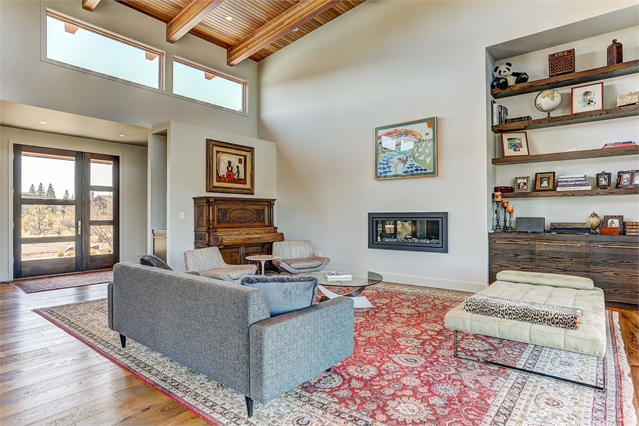 View of Great Room Featuring Wood Beams and Built-ins