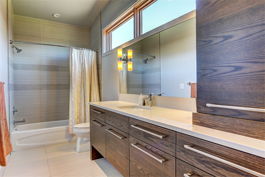 Spa-Like Bathroom with Natural Light and Wood Accents