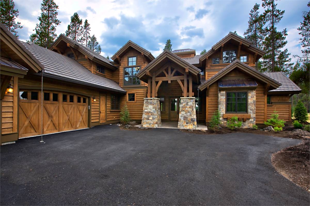 A Stunning Gabled Entry Accented With Stone Columns
