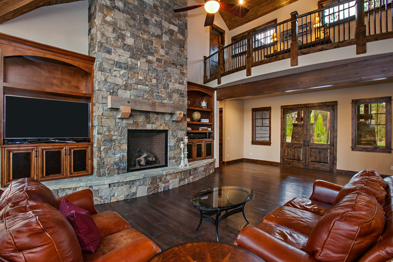 Stone Fireplace Flanked By Beautiful Built-Ins