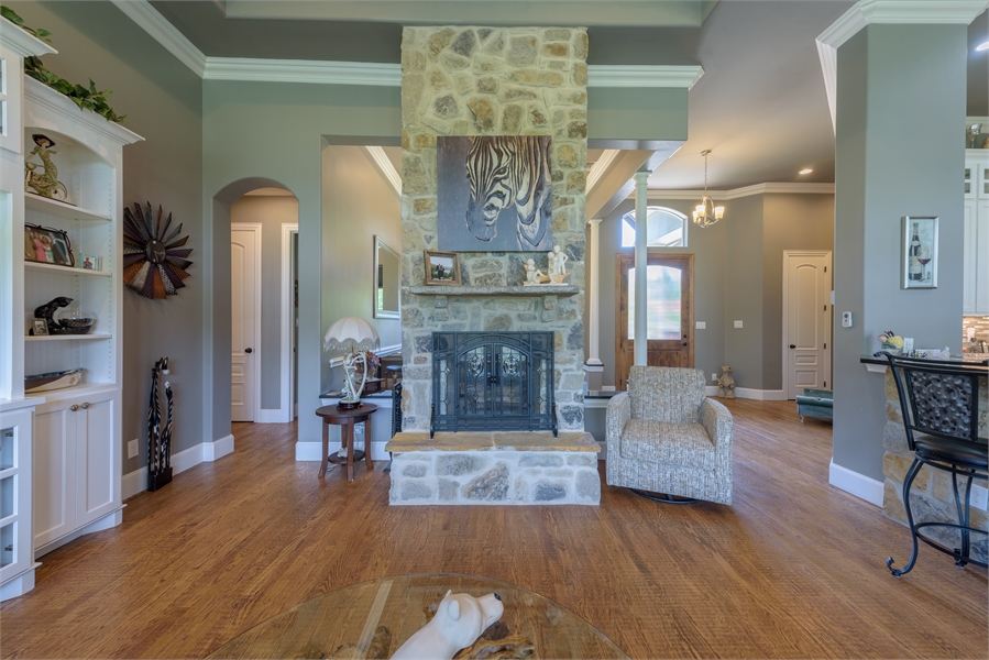 A Double Sided Fireplace in Family & Dining Room