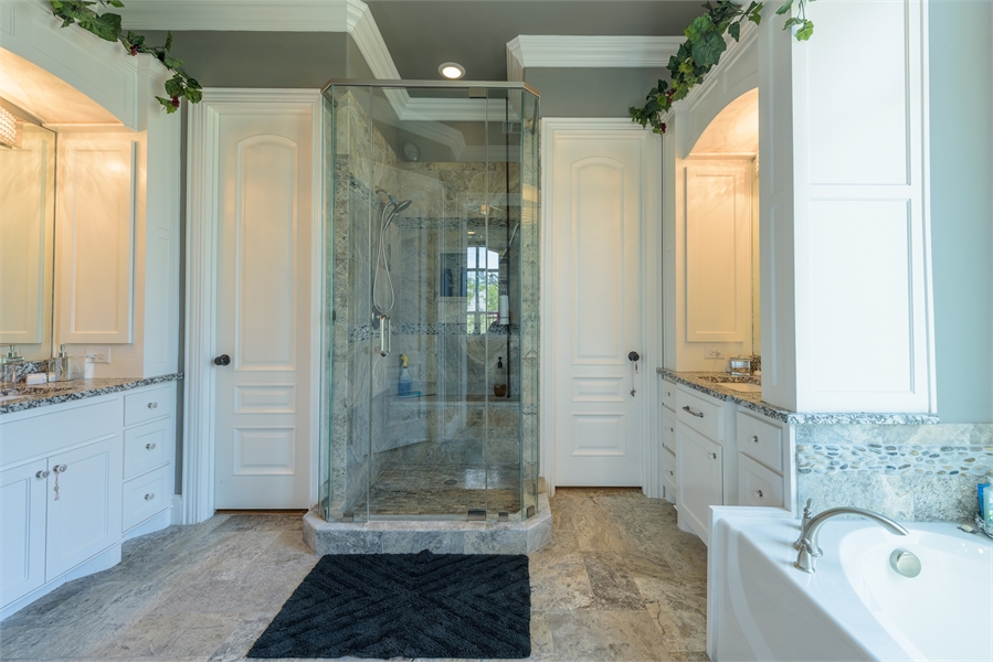 Spa-Like Bathroom Featuring Glass Shower & Double Vanities image of Vita Encantata House Plan