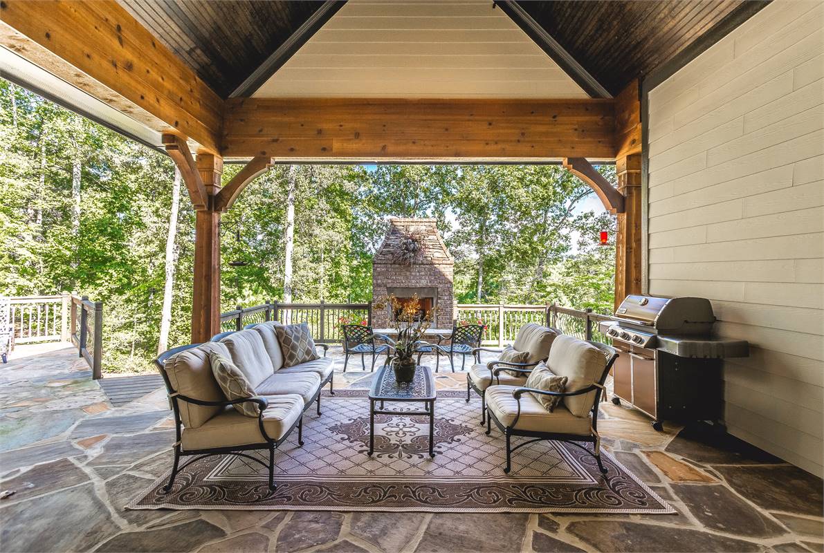 A Custom Outdoor Fireplace Adds Lots of Ambience image of Reconnaissante Cottage House Plan