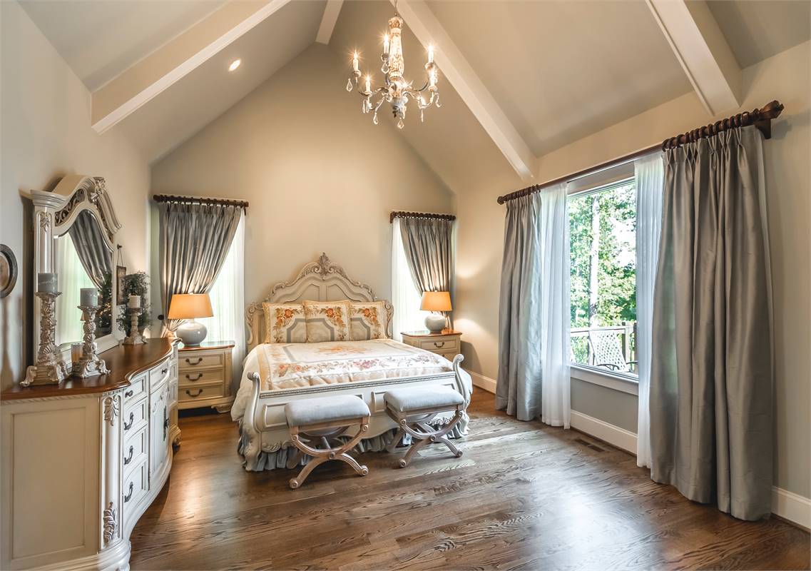 A Beautiful Primary Bedroom with Vaulted Ceiling image of Reconnaissante Cottage House Plan