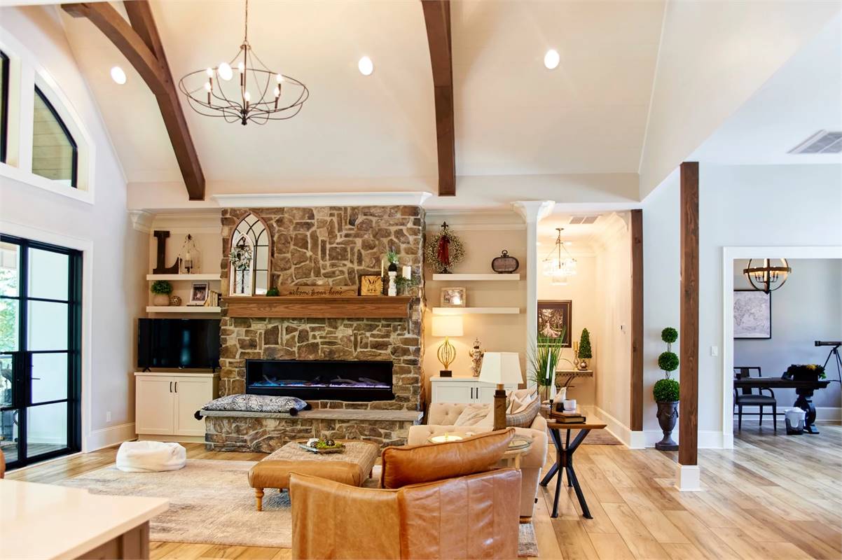 A Stone Fireplace Flanked with Custom Built-Ins
