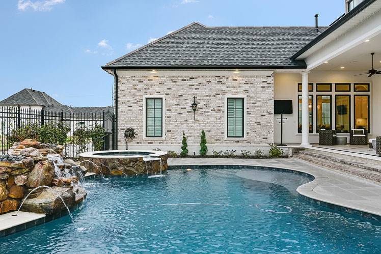 Pool Enhanced with Natural Rocks and Fountains