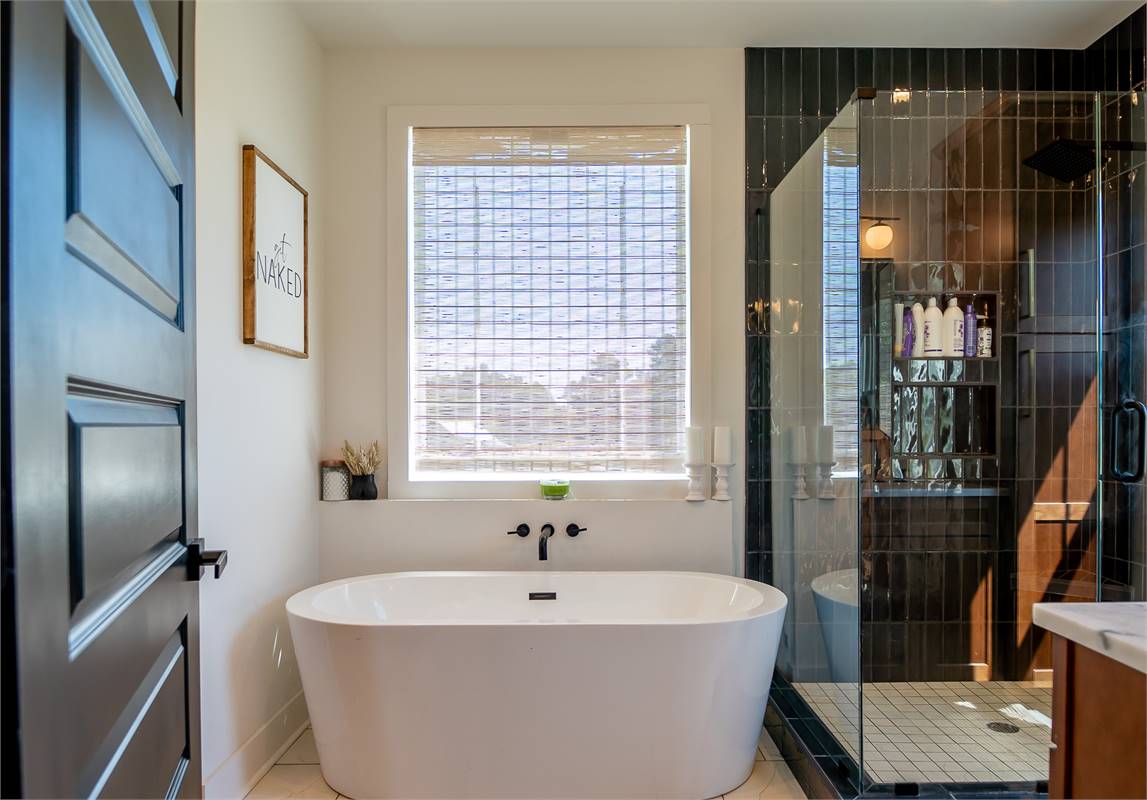 Primary Ensuite Bath With Soaking Tub & Walk-In Shower image of Chelci House Plan