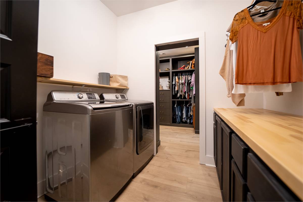 A Laundry Room Conveniently Located Near Master Closet image of Chelci House Plan