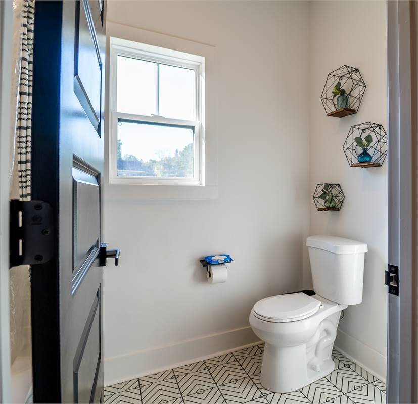 Powder Room Located Near Kitchen image of Chelci House Plan