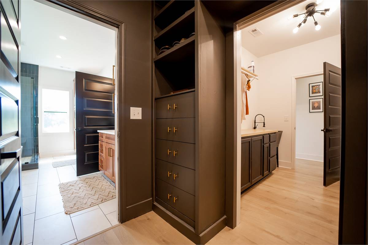 Primary Bedroom Closet with Easy Access to Laundry Room image of Walden House Plan