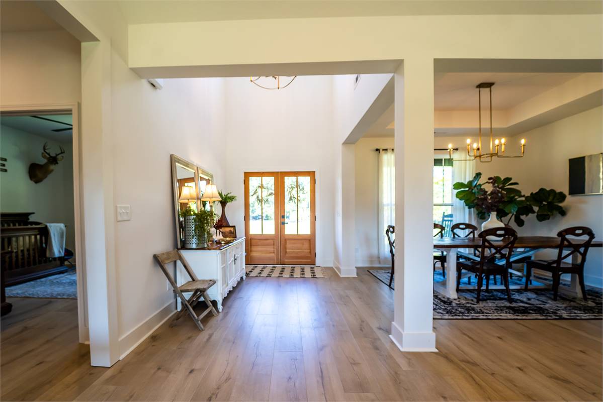 Open Front Entry and Foyer with Adjoining Dining Room image of Walden House Plan