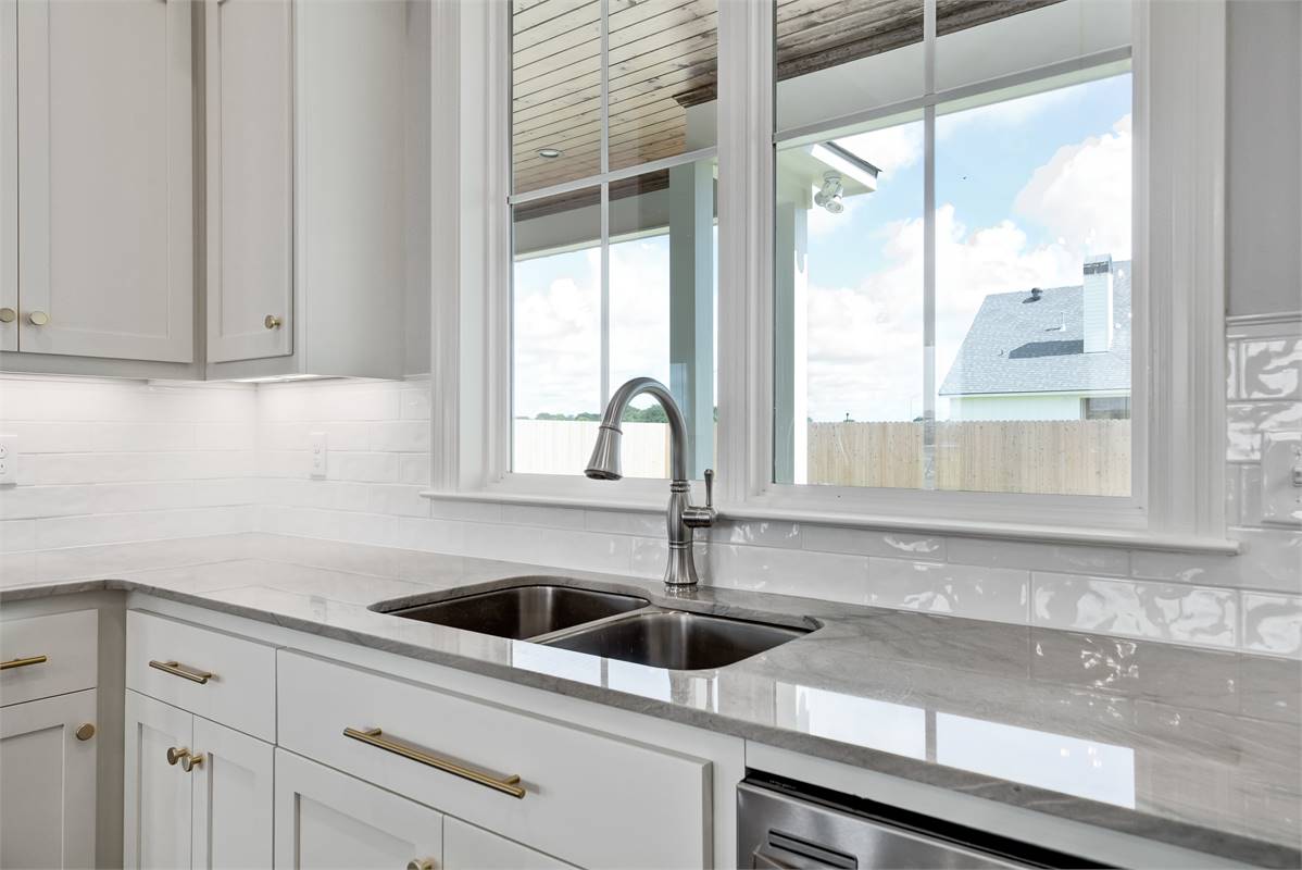 Beautiful Kitchen Sink and View to Wrap Around Porch