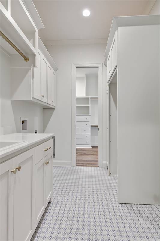 Laundry Room with Access to Master Closet