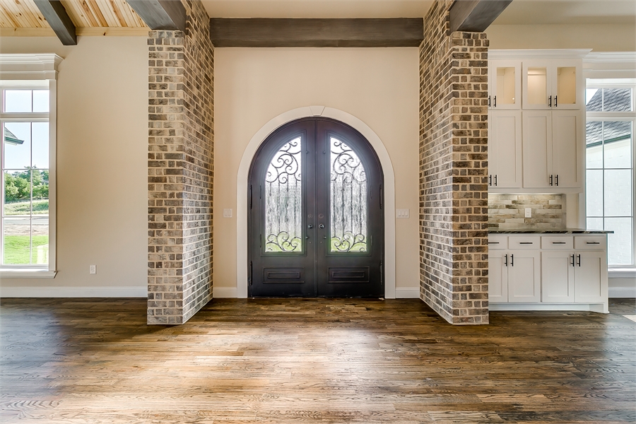 Stunning Interior Front Entry with Palladian Door and Brick