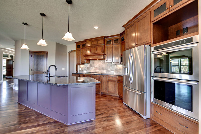 Kitchen image of 3-Story Craftsman with Sport Court House Plan