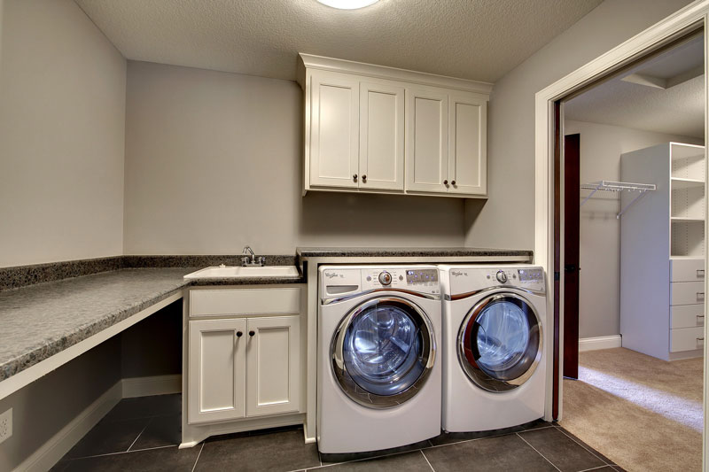 Laundry Room image of 3-Story Craftsman with Sport Court House Plan