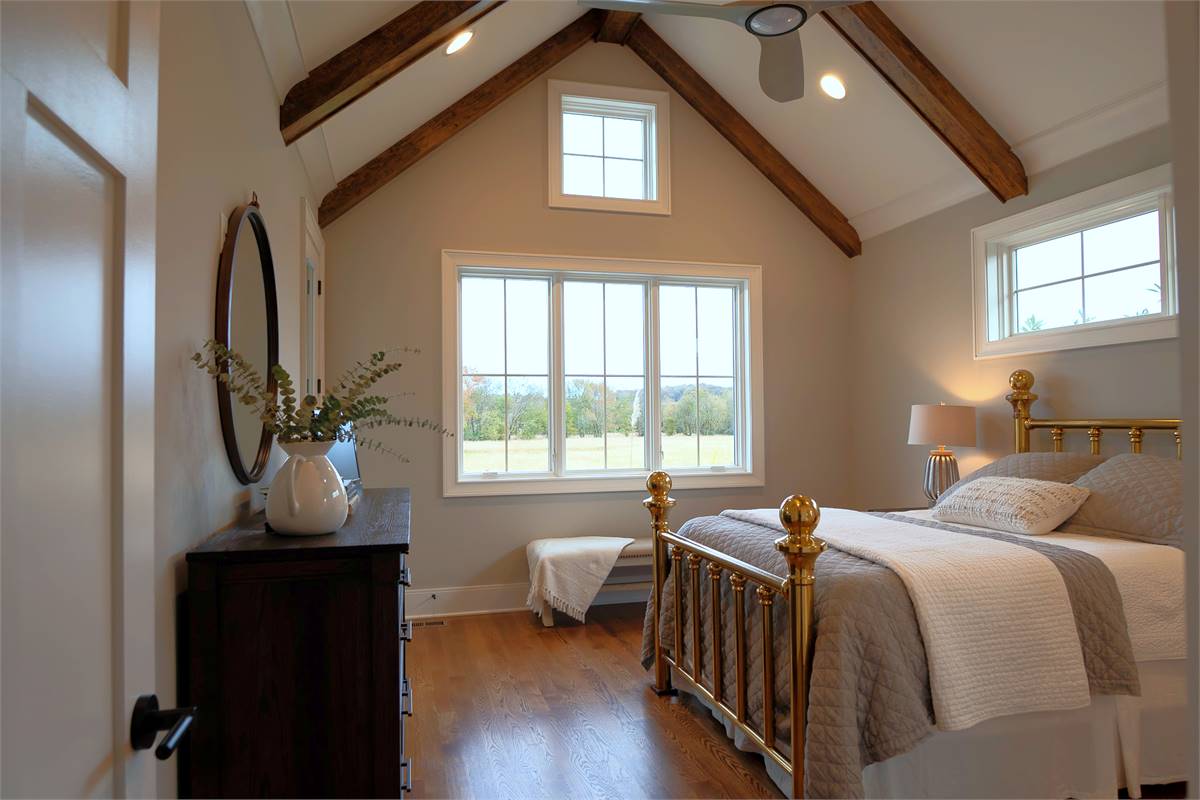 Peaceful Master bedroom view with Beams and High Ceiling
