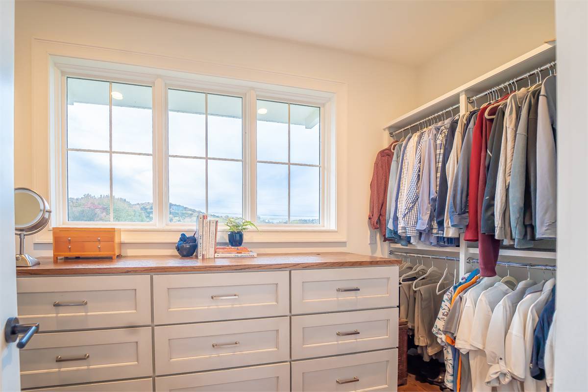 A Large Walk-In Closet Makes Organizing Easy