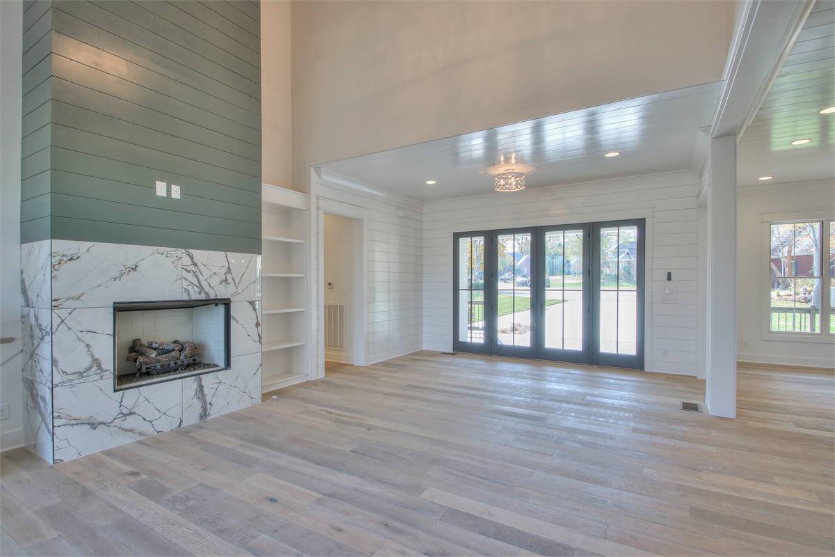 Great Room with Cathedral Ceilings & Shiplap Fireplace