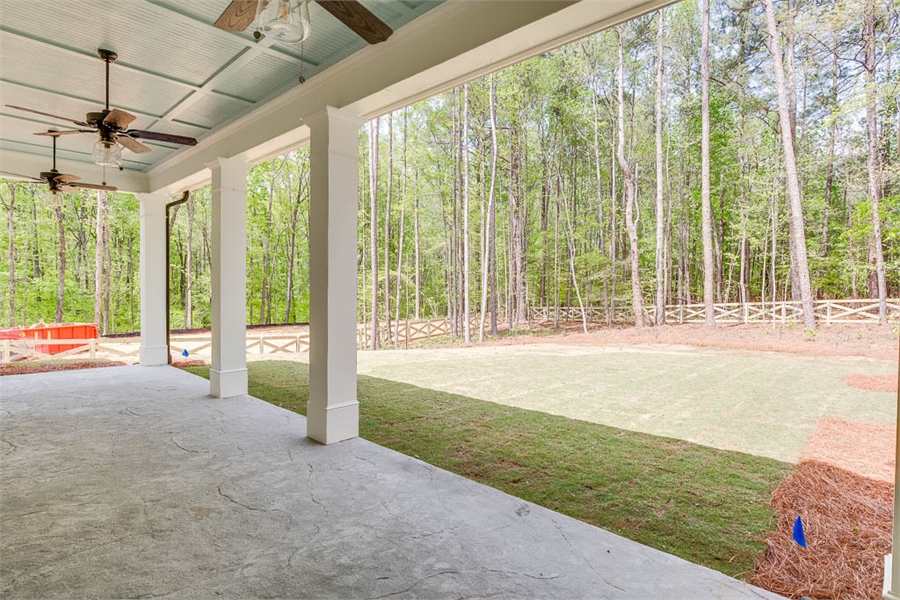 Covered Rear Porch Featuring Columns and Coffered Ceiling image of Tiverton House Plan