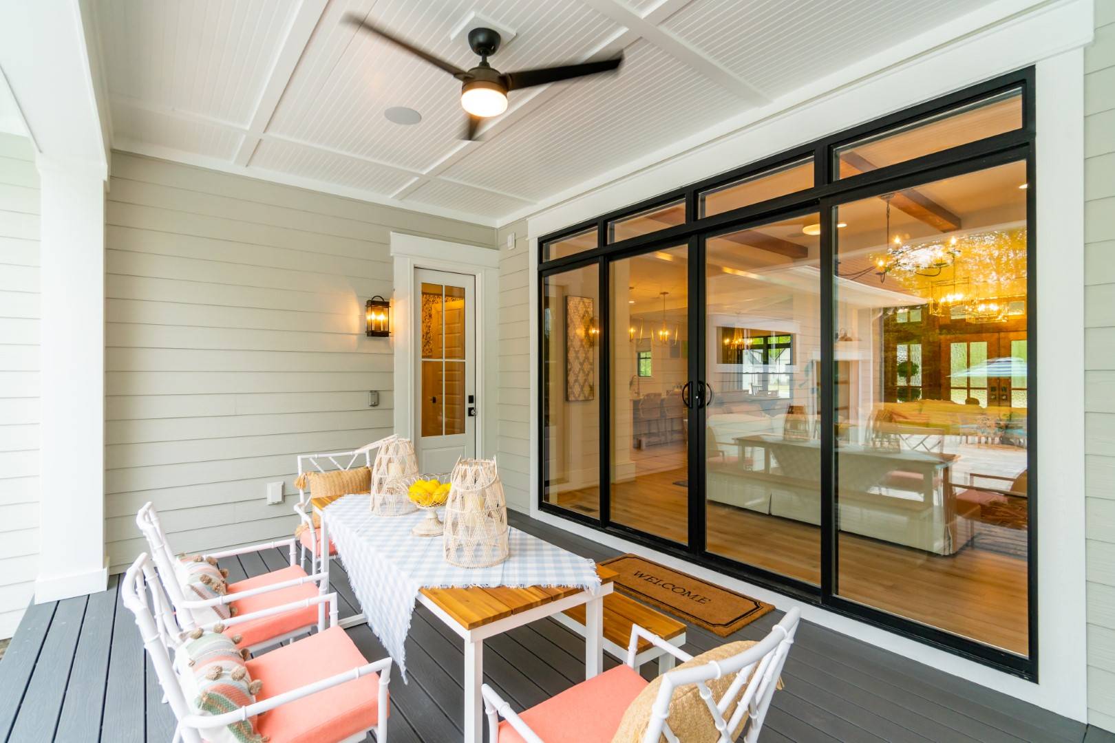 Relaxing Rear Porch featuring Large Folding Glass Doors
