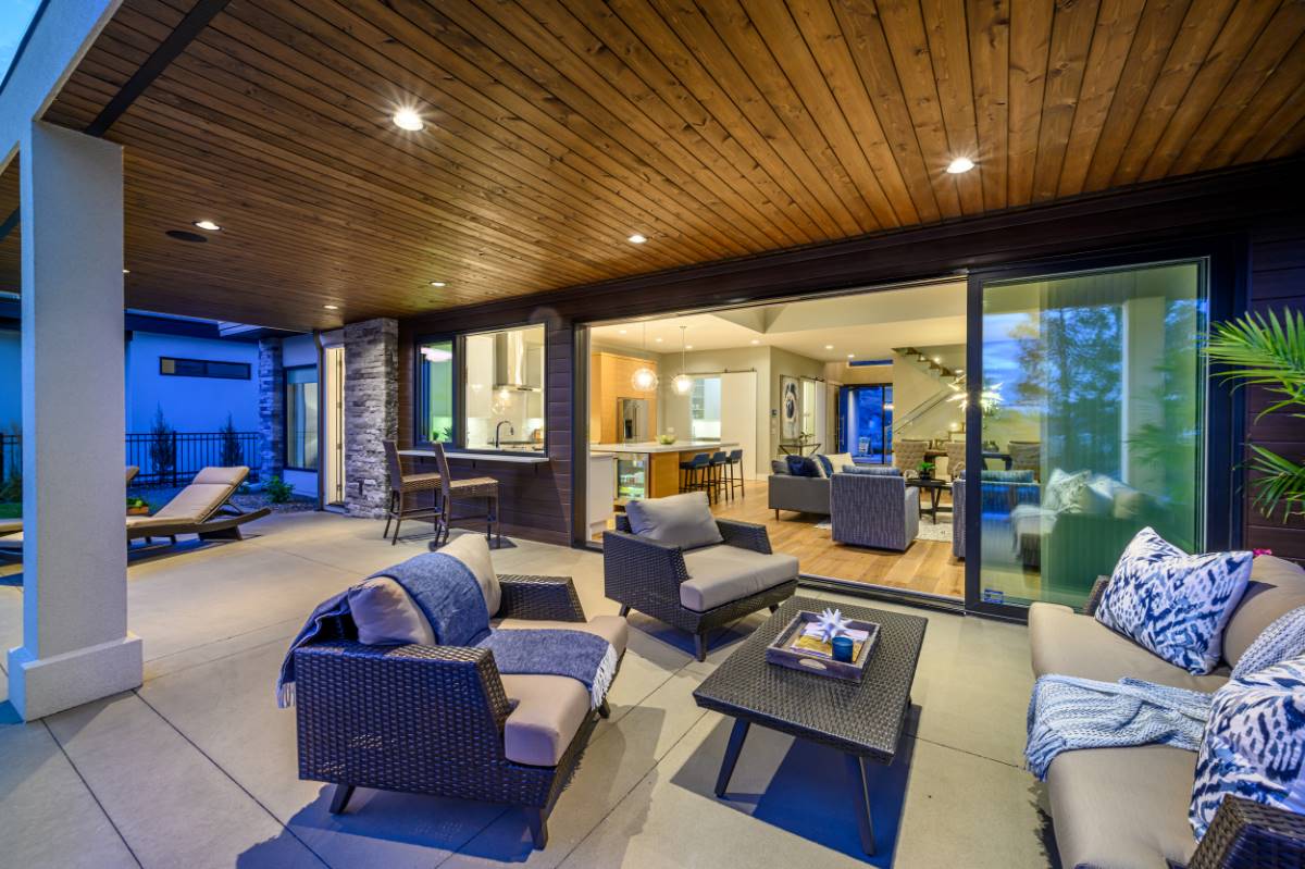 A Wood Paneled Ceiling Adds Ambience to Covered Deck